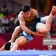 Фото gettyimages. Амантур Исмаилов (сверху) на Азиатских играх-2018